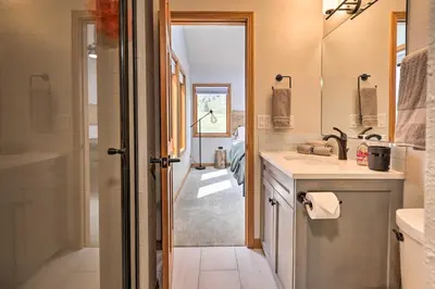 a bathroom with a sink and a shower at Evergreen Mountain Duplex with Trail Access! in Idaho Springs