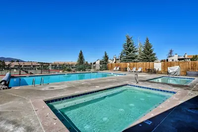 a large swimming pool in a yard at Warm Fraser Townhome with Community Amenities! in Fraser