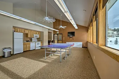 a ping pong table in the middle of a kitchen at Warm Fraser Townhome with Community Amenities! in Fraser