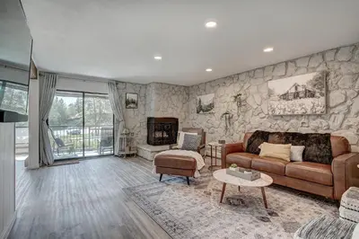 a living room with a couch and a fireplace at Mountain luxury on Lake Dillon, close to all the best ski resorts in Colorado! in Dillon