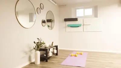 a living room with a mirror and a table at Family-Friendly Retreat 30-Night Minimal in Denver