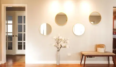 a room with four mirrors and a vase with flowers at Family-Friendly Retreat 30-Night Minimal in Denver