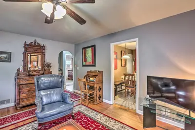 a living room with a chair and a television at Relaxing Golden Getaway with Grill Less Than 1 Mi to Town! in Golden