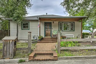 a house with a wooden fence in front of it at Relaxing Golden Getaway with Grill Less Than 1 Mi to Town! in Golden