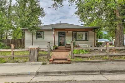 a small house with a wooden fence in front of it at Relaxing Golden Getaway with Grill Less Than 1 Mi to Town! in Golden