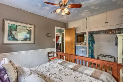 a bedroom with a ceiling fan and a bed at Relaxing Golden Getaway with Grill Less Than 1 Mi to Town! in Golden