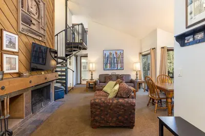 a living room with a couch and a fireplace at 1196 Flying Dutchman condo in Keystone