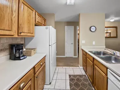 a kitchen with a white refrigerator and a sink at Swans Nest Villa 1304 condo in Breckenridge