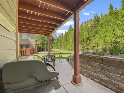 a covered porch with a chair on a patio at Swans Nest Villa 1304 condo in Breckenridge