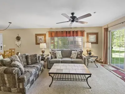a living room with a couch and a ceiling fan at Swans Nest Villa 1304 condo in Breckenridge