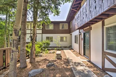 an exterior view of a home with trees at Estes Park Condo about 1 Mi to RMNP! in Estes Park