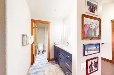 a bathroom with a sink and a mirror at Red Hawk Townhome 2350 in Keystone