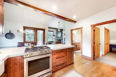 a kitchen with wooden cabinets and a stove top oven at Red Hawk Townhome 2350 in Keystone