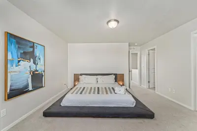 a bedroom with a large bed in a room at Centrally Located, Comfortable Home in Music City in Fort Collins