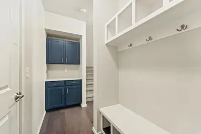 a kitchen with blue cabinets and a white wall at Centrally Located, Comfortable Home in Music City in Fort Collins