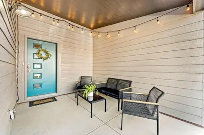 two chairs and a table on a patio at Centrally Located, Comfortable Home in Music City in Fort Collins