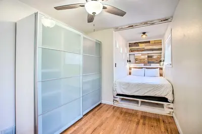 a bedroom with a bed and a sliding glass door at Modern House with Yard Less Than 7 Mi to Downtown Denver! in Denver