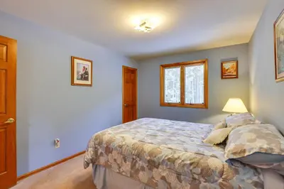 a bedroom with a bed and a window at Silver Plume Mountain Haven with Views and Deck! in Silver Plume