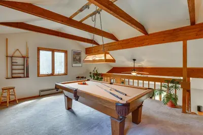 a pool table in a room with wooden ceilings at Silver Plume Mountain Haven with Views and Deck! in Silver Plume