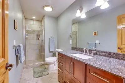a bathroom with a sink and a toilet and a shower at Silver Plume Mountain Haven with Views and Deck! in Silver Plume
