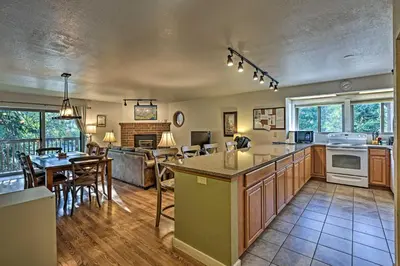 a kitchen and living room with a table and chairs at Less Than 2 Mi to Frisco Adventure Park Cozy Townhome! in Frisco