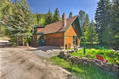 a log cabin with a gravel road in front of it at Chicago Creek B and B 1 Mi to Mt Blue Sky! in Idaho Springs