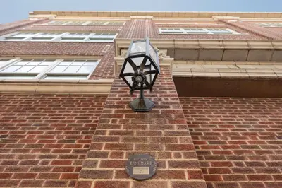 a street light on the side of a brick building at The Slate Hotel Denver Downtown, Tapestry by Hilton in Denver