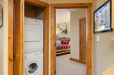 a laundry room with a washer and dryer at 3066 Timbers condo in Keystone