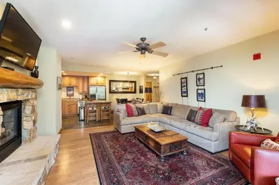a living room with a couch and a fireplace at 3066 Timbers condo in Keystone
