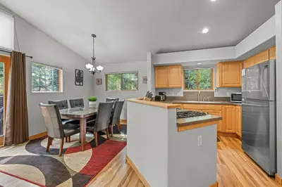 a kitchen and dining room with a table and chairs at Cutty Sark Grand Combo 6BR 4,5BA townhouse in Silverthorne