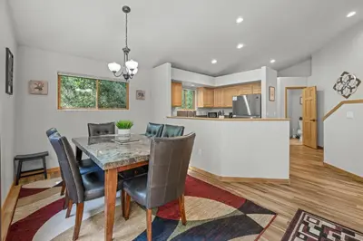 a dining room and kitchen with a table and chairs at Cutty Sark Grand Combo 6BR 4,5BA townhouse in Silverthorne