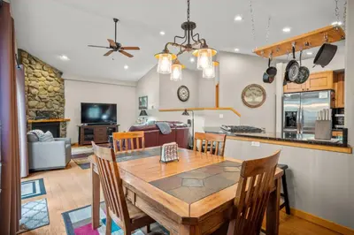 a dining room and kitchen with a table and chairs at Cutty Sark Grand Combo 6BR 4,5BA townhouse in Silverthorne