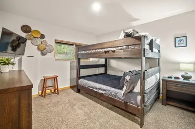 a bedroom with two bunk beds and a desk at Cutty Sark Grand Combo 6BR 4,5BA townhouse in Silverthorne
