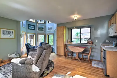 a living room with a couch and a table at Loveland Guest House with Balcony by Boyd Lake in Loveland