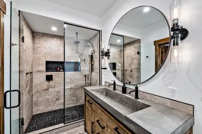 a bathroom with a sink and a mirror at Slice of Heaven just steps from Lake Estes! Indoor/Outdoor Fireplace and Jacuzzi in Estes Park