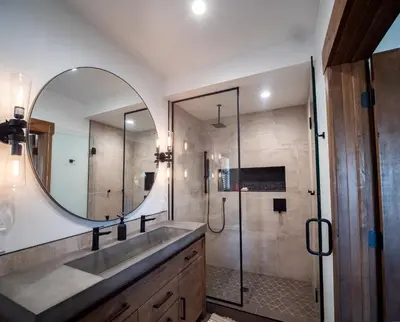 a bathroom with a sink and a mirror at Slice of Heaven just steps from Lake Estes! Indoor/Outdoor Fireplace and Jacuzzi in Estes Park