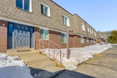 a brick building with stairs in the snow in front at 7 Mi to Ski Resort Dillon Condo with Mtn Views in Dillon