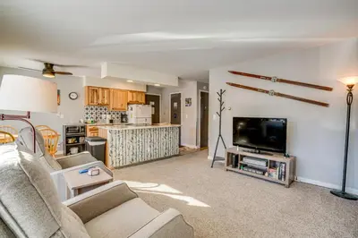 a living room with a couch and a tv at 7 Mi to Ski Resort Dillon Condo with Mtn Views in Dillon