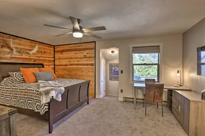 a bedroom with a bed and a desk at 2 Mi to Rocky Mtn Natl Park Grand Lake Condo in Grand Lake