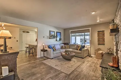 a living room with a couch and a table at 2 Mi to Rocky Mtn Natl Park Grand Lake Condo in Grand Lake
