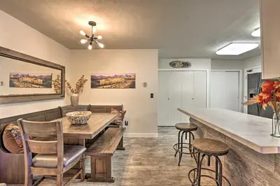 a dining room with a table and some chairs at 2 Mi to Rocky Mtn Natl Park Grand Lake Condo in Grand Lake
