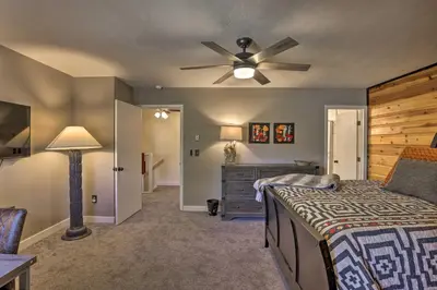 a bedroom with a bed and a ceiling fan at 2 Mi to Rocky Mtn Natl Park Grand Lake Condo in Grand Lake