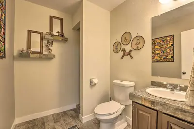 a bathroom with a toilet and a sink at 2 Mi to Rocky Mtn Natl Park Grand Lake Condo in Grand Lake