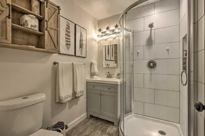 a bathroom with a shower and a toilet and a sink at 2 Mi to Rocky Mtn Natl Park Grand Lake Condo in Grand Lake