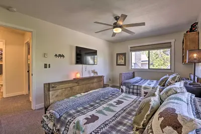 a bedroom with two beds and a ceiling fan at 2 Mi to Rocky Mtn Natl Park Grand Lake Condo in Grand Lake