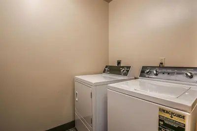 a laundry room with a sink and a washing machine at 8115 Arapahoe Lodge condo in Keystone
