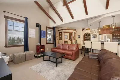 a living room with a couch and a table at Cozens Pointe B-301 condo in Fraser