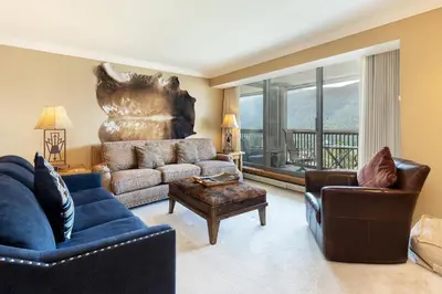 a living room with a couch and chairs and a window at 2534 Saints Johns condo in Keystone
