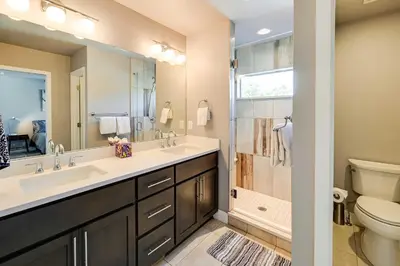 a bathroom with a sink and a toilet and a shower at Heated Rooftop Deck and Mtn Views Denver Retreat in Englewood