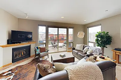 a living room with a couch and a fireplace at WinterStar E-2 in Fraser